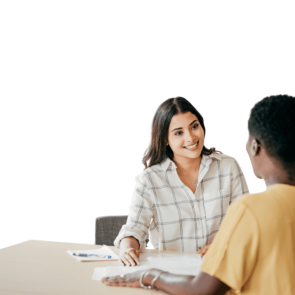 Interviewer speaking with a candidate across a table